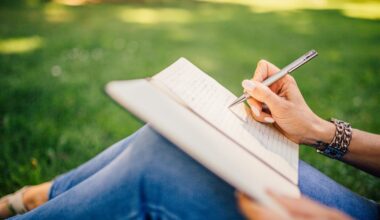 Photo of a woman writing on a Notebook