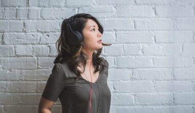 Image of a young woman listening to music with headphones