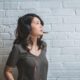 Image of a young woman listening to music with headphones